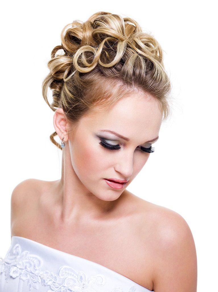 Beautiful bride with fashion wedding hairstyle -  on white background